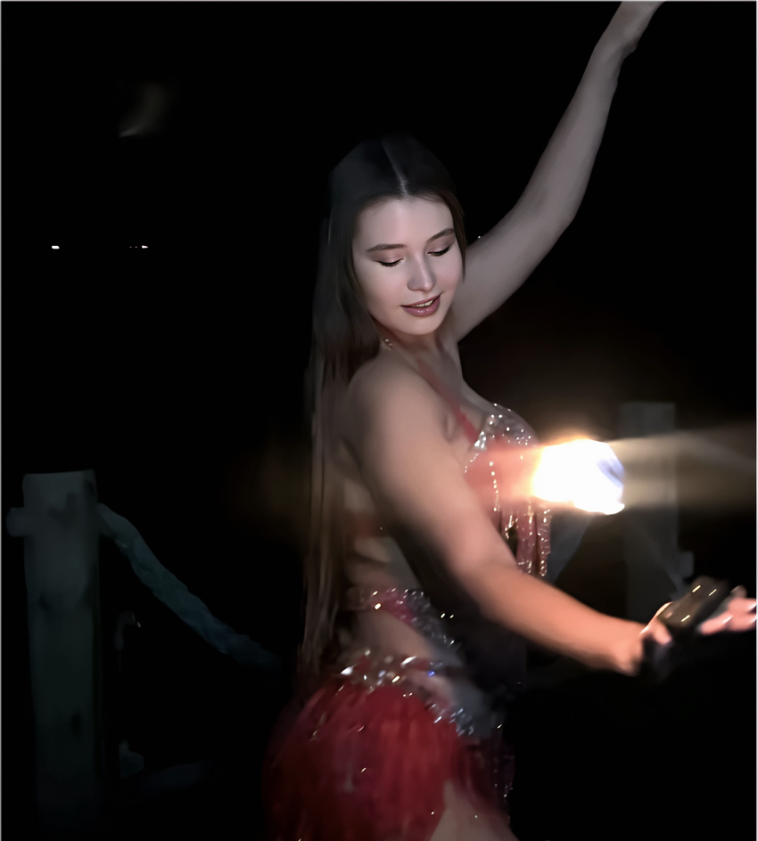 Coni on stage in a red crystal costume